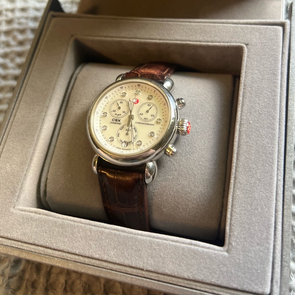 Woman’s Michele stainless steel diamond watch with leather band. MW03M00A0046